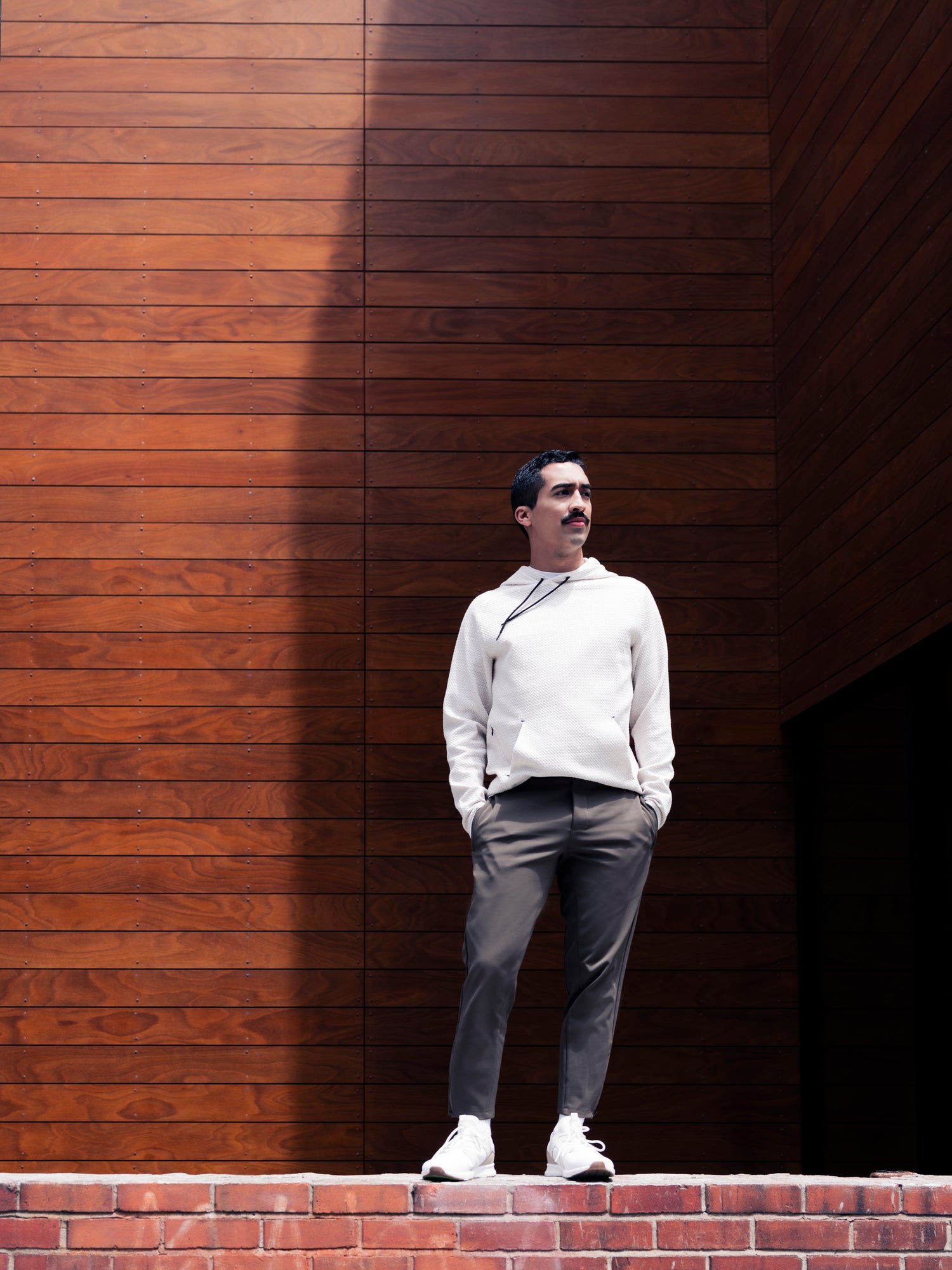 Man standing on ledge wearing Andy Joggers