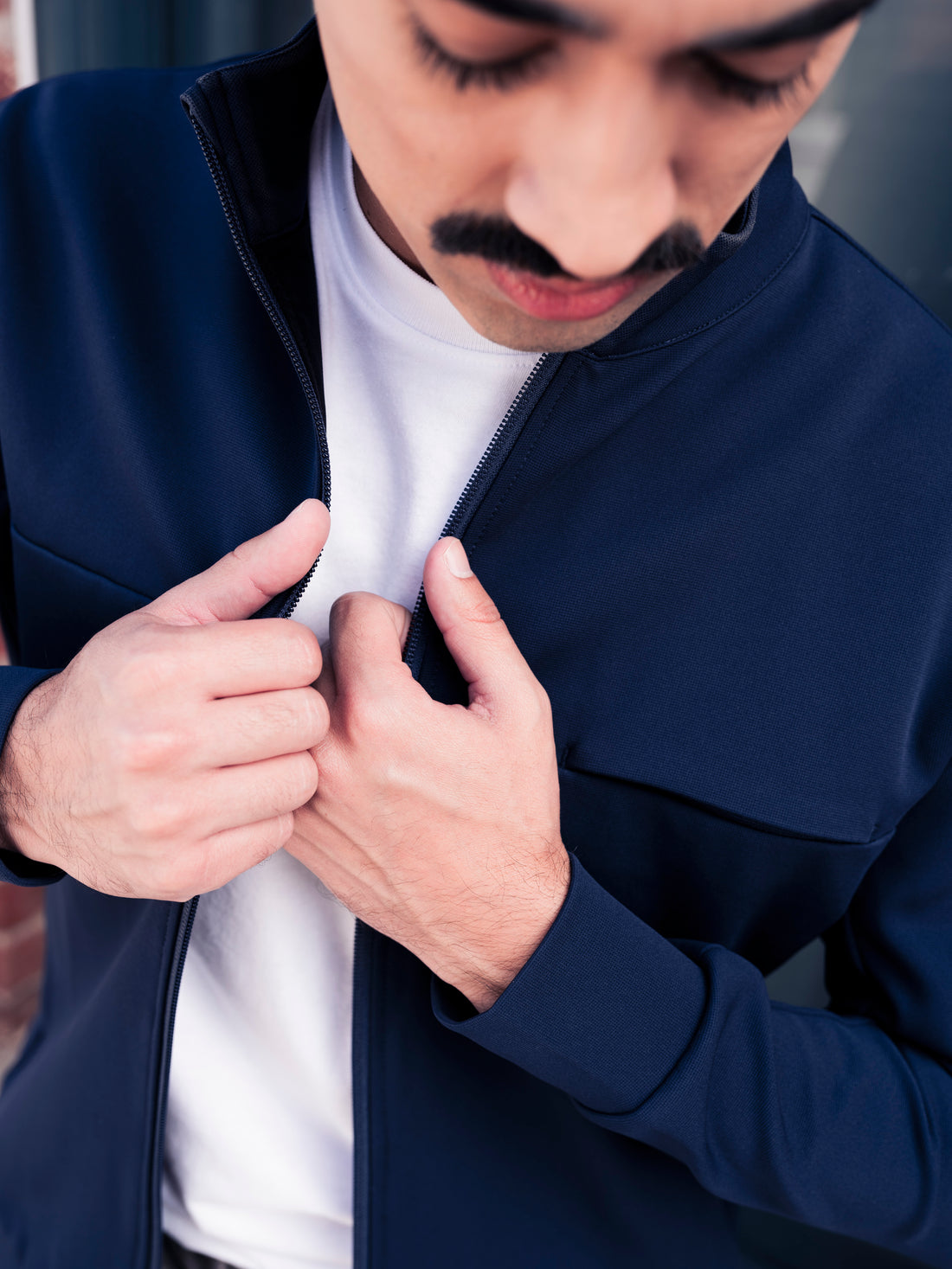 Closeup of man wearing Hunter Jacket in Cobalt Navy