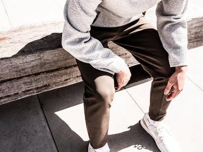 Man sitting on bench wearing Andy Joggers